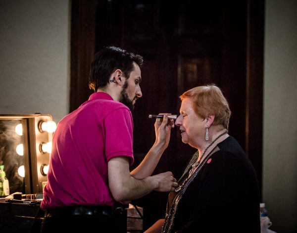 Heather Birch gets her make up touched up. Photo by Bryony Jackson.