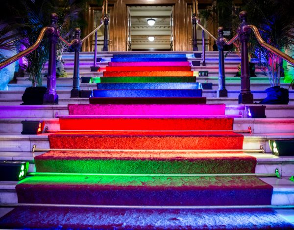 The rainbow staircase entrance to The Coming Back Out Ball. Photo by Bryony Jackson.